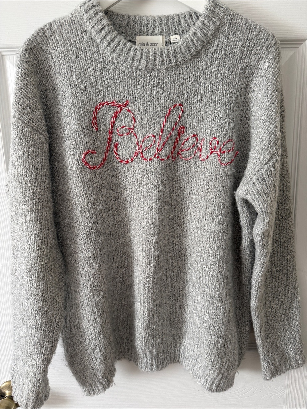 Believe sweater